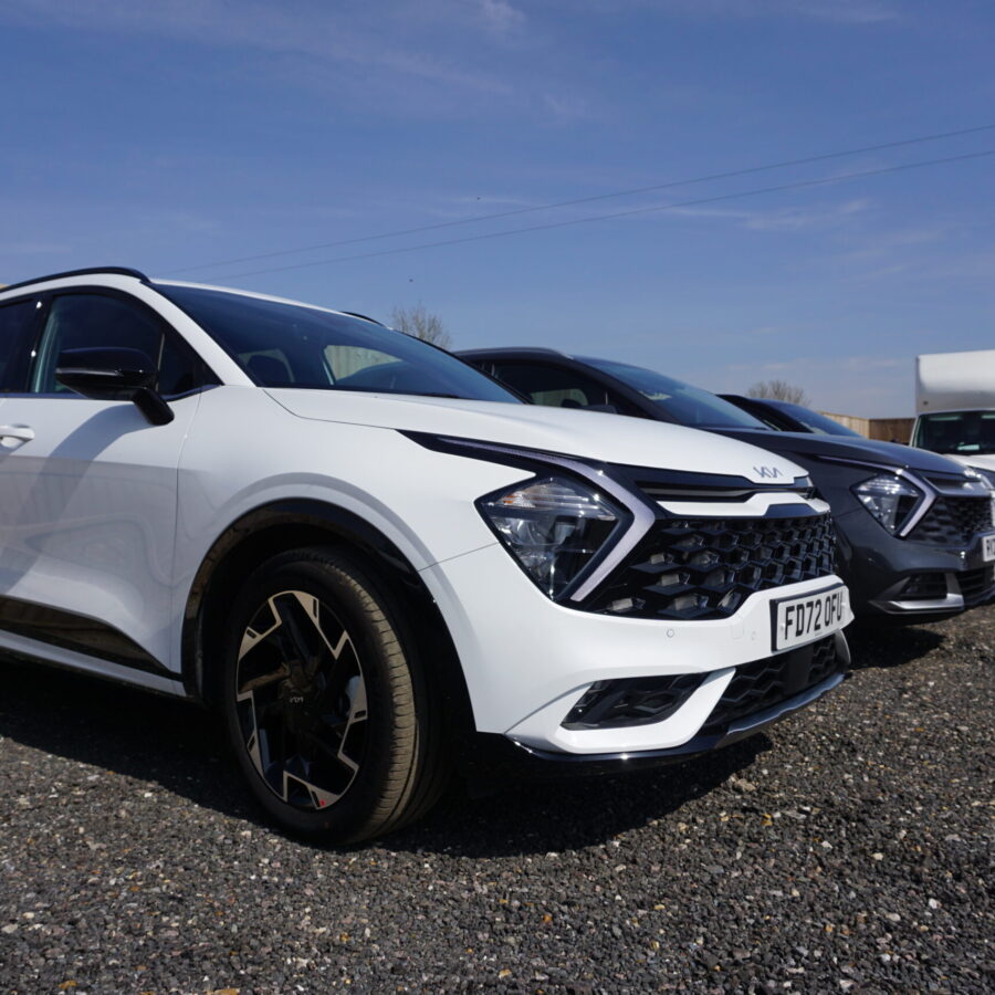 Kia Sportage white in our yard